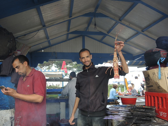 Vendors with langouste in a market in Essaouira