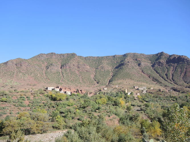 Deeper valleys of the Atlas Mountains near the rivers are green and habituaed